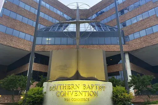 A cross and Bible sculpture stand outside the Southern Baptist Convention headquarters in Nashville, Tenn., May 24, 2022. On Tuesday, Sept. 20, 2022, the Southern Baptists' top administrative body voted to cut ties with two congregations: an LGBTQ-friendly church in North Carolina that had itself quit the denomination decades earlier and a New Jersey congregation it cited for “alleged discriminatory behavior.” (AP Photo/Holly Meyer, File)