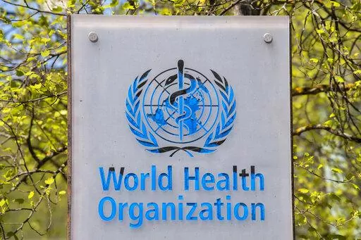 The logo and building of the World Health Organization (WHO) headquarters in Geneva, Switzerland, 15 April 2020. The World Health Organization says on Thursday, Jan. 6, 2022 a record 9.5 million cases of COVID-19 were tallied around the world over the last week, noting a 71% surge in the weekly count of infections amounting to a “tsunami” as the new omicron variant sweeps worldwide. But there was a decrease in the number of new deaths recorded. (Martial Trezzini/Keystone via AP, file)