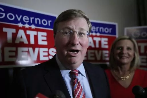 With wife Elee Reeves at his side, Mississippi Gov. Tate Reeves speaks in Jackson, Miss., after winning the Republican primary on Tuesday, Aug. 8, 2023. Records show Tate Reeves received a $10,000 campaign contribution from a shipping company executive in 2020, several days before the state announced incentives for a division of the company to expand its operation in Mississippi. (AP Photo/Rogelio V. Solis, File)