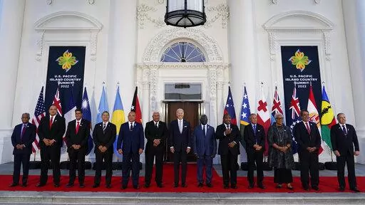 President Joe Biden, center, poses for a photo with Pacific Island leaders on the North Portico of the White House in Washington, Sept. 29, 2022. From left, New Caledonia President Louis Mapou, Tonga Prime Minister Siaosi Sovaleni, Palau President Surangel Whipps Jr., Tuvalu Prime Minister Kausea Natano, Micronesia President David Panuelo, Fiji Prime Minister Josaia Voreqe Bainimarama, Biden, Solomon Islands Prime Minister Manasseh Sogavare, Papua New Guinea Prime Minister James Marape, Marshall