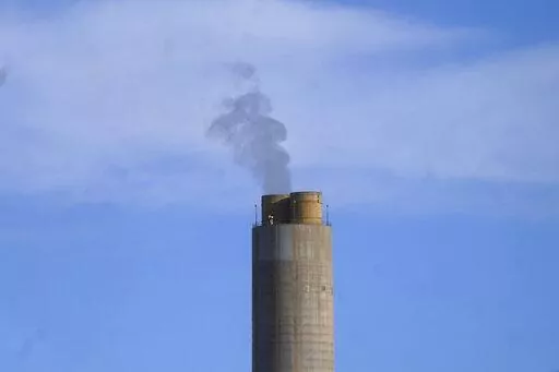 A smokestack stands at a coal plant on Wednesday, June 22, 2022, in Delta, Utah. On Monday, Sept. 19, the world’s first public database of fossil fuel production, reserves and emissions launches.  It shows that the United States and Russia have enough fossil fuel reserves to exhaust the world’s remaining carbon budget to stay under 1.5 degrees Celsius warming. (AP Photo/Rick Bowmer, File)