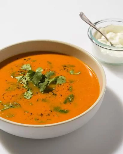 This image released by Milk Street shows a recipe for Indian-style tomato-ginger soup. (Milk Street via AP)