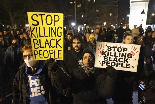 Demonstrators hold signs during a protest at Washington Square Park in New York on Jan. 28, 2023, in response to the death of Tyre Nichols, who died after being beaten by Memphis police during a traffic stop. The beating and death of Nichols by members of a plainclothes anti-crime task force has renewed scrutiny on the squads often involved in a disproportionate number of use of force incidents and civilian complaints. (AP Photo/Yuki Iwamura, File)