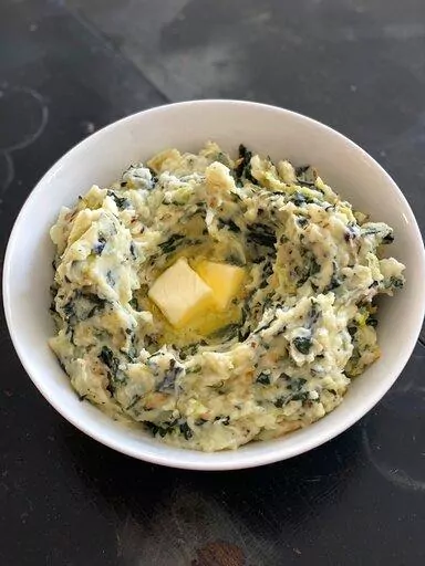 A recipe for Colcannon, a classic Irish medley of mashed potatoes and greens, appears in New Milford, Conn., on Feb. 28, 2022. (Katie Workman via AP)