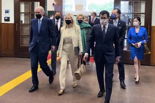 From left U.S. Democrat Sen. Ed Markey of Massachusetts, left, and Democratic House member John Garamendi of California, second left, back, arrive with their wives at the parliament building in Taipei, Taiwan, Monday, Aug. 15, 2022. Taiwan's President Tsai Ing-wen met Monday with a delegation of U.S. Congress members in a further sign of support among American lawmakers for the self-governing island that China claims as its own territory. (AP Photo/Johnson Lai)