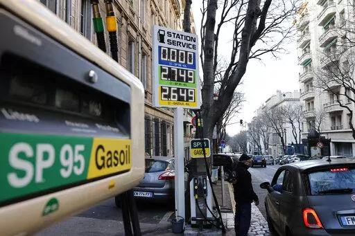 A car stops in a gas station where prices are up to 2,75 euros per liter (US dlrs. 3.04) in Marseille, southern France, Wednesday, March 9, 2022. Shocking pictures from the Ukrainian town of Bucha and accusations of Russian war crimes are building pressure for more sanctions against Moscow, Monday, April 4, 2020. A key potential target: Russian oil and natural gas, and the $850 million that European importers pay for those supplies every day. But it's not so easy, given Europe's dependence on Ru