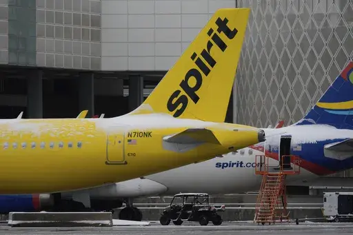 Spirit Airlines planes parked at the closed George Bush Intercontinental Airport Tuesday, Jan. 21, 2025, in Houston. (AP Photo/David J. Phillip)