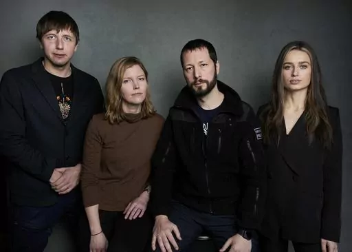 Photographer Evgeniy Maloletka, from left, "Frontline" producer/editor Michelle Mizner, director Mstyslav Chernov, and field producer Vasilisa Stepanenko pose for a portrait to promote the film "20 Days in Mariupol" at the Latinx House during the Sundance Film Festival on Sunday, Jan. 22, 2023, in Park City, Utah. The film is a joint project between The Associated Press and PBS "Frontline." (Photo by Taylor Jewell/Invision/AP, File)