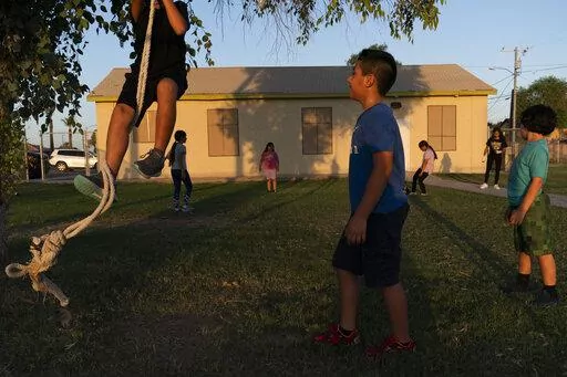Children play in the yard of a community boxing club Thursday, Aug. 19, 2021, in Somerton, Ariz. The U.S. Census Bureau on Thursday, March 10, 2022, released two reports which measure how well the once-a-decade head count tallied every U.S. resident and whether certain populations were undercounted or overrepresented in the count. Any undercounts in various populations can shortchange the amount of funding and political representation they get over the next decade. (AP Photo/Jae C. Hong, File)
