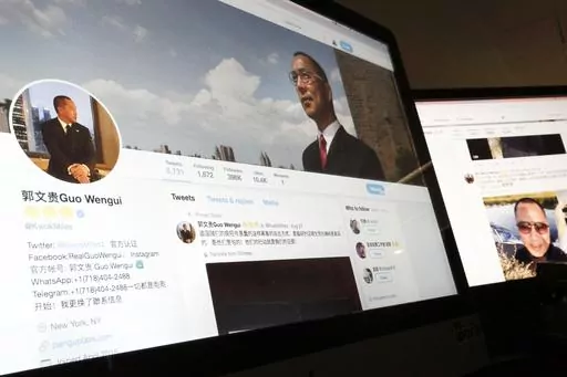A Twitter page of Chinese exiled businessman Guo Wengui is seen on a computer screen in Beijing, Aug. 30, 2017. The self-exiled Chinese businessman long sought by the government of China, and known for cultivating ties to Trump administration figures including Steve Bannon, was arrested Wednesday, March 15, 2023, in New York on charges that he oversaw a billion dollar fraud conspiracy. Guo Wengui, also known as Ho Wan Kwok, and his financier, Kin Ming Je, were charged in an indictment in Manhatt