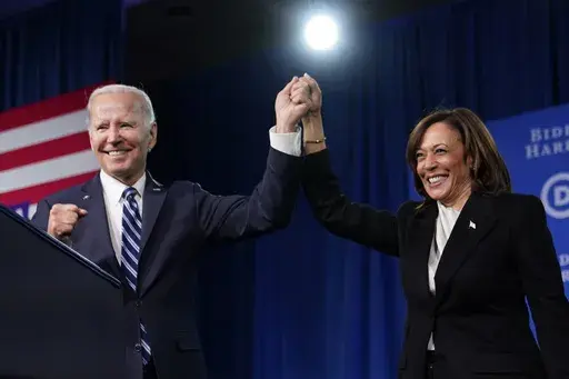 President Joe Biden and Vice President Kamala Harris stand on stage at the Democratic National Committee winter meeting, Feb. 3, 2023, in Philadelphia. (AP Photo/Patrick Semansky, File)