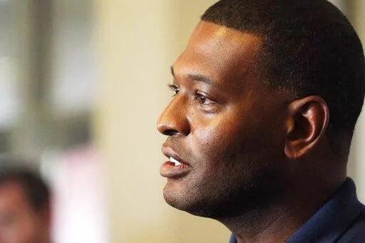 Environmental Protection Agency Administrator Michael Regan discusses elements of a coordinated response of federal, state and city agencies, that he hopes will help deal with the city's long-standing water problems, during a news briefing, Sept. 7, 2022, in Jackson, Miss. The Biden administration is proposing lower limits for a deadly air pollutant, saying tougher standards for soot from tailpipes, smokestacks and wildfires could prevent thousands of premature deaths a year. (AP Photo/Rogelio V