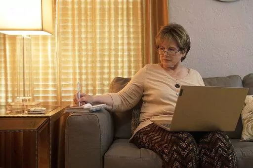 This photo provided by the Providence Cancer Institute of Oregon in May 2022 shows Kathy Wilkes of Ormond Beach, Fla. Wilkes, with advanced pancreatic cancer, saw her tumors dramatically shrink after researchers in Oregon turbocharged her own immune cells, highlighting a possible new way to someday treat a variety of cancers. (Providence Cancer Institute of Oregon via AP)