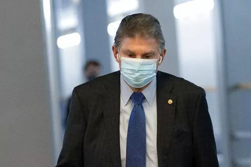 Sen. Joe Manchin, D-W.Va., walks to a vote in the Senate Chamber, Dec. 15, 2021, in Washington. (AP Photo/Jacquelyn Martin, File)