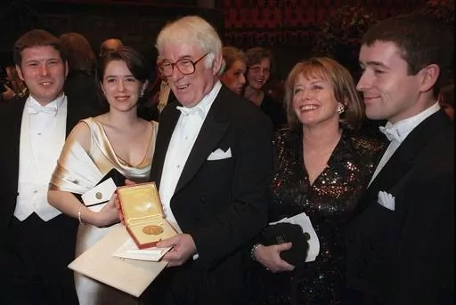 Irish poet Seamus Heaney, center, displays his Nobel literature prize medal, surrounded by his family, after receiving it from the Swedish King Carl XVI Gustaf at the Concert Hall in Stockholm, Sweden on Dec. 10, 1995. Heaney's family are from left: his son Michael, daughter Catherine, his wife Marie and son Christopher. Presidents have long made a point of citing a favorite writer, and for President Joe Biden that often has been Heaney, renowned for what Nobel judges in 1995 called “works of 