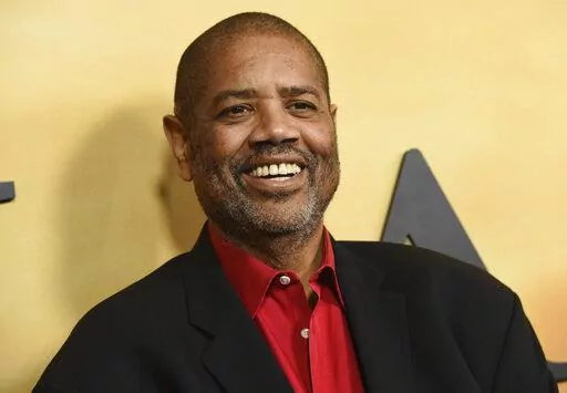 Gregory Allen Howard arrives at the Los Angeles premiere of "Harriet" on Oct. 29, 2019. Howard, who skillfully adapted stories of historical Black figures in “Remember the Titans” starring Denzel Washington, “Ali” with Will Smith and “Harriet” with Cynthia Erivo, died Friday at a hospital in Miami of heart failure, according to publicist Jeff Sanderson. He was 70. (Photo by Chris Pizzello/Invision/AP, File)