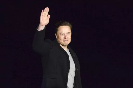 SpaceX's Elon Musk waves while providing an update on Starship, on Feb. 10, 2022, near Brownsville, Texas. Twitter on Thursday, Dec. 15, 2022, suspended the accounts of journalists who cover the social media platform and Musk, including reporters working for The New York Times, Washington Post, CNN and other publications (Miguel Roberts/The Brownsville Herald via AP, File)