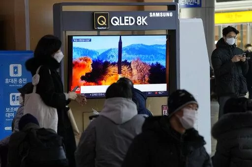 People watch a TV showing an image of North Korea's missile launch during a news program at the Seoul Railway Station in Seoul, South Korea, Monday, Jan. 31, 2022. North Korea confirmed Monday it test-launched an intermediate-range ballistic missile capable of reaching the U.S. territory of Guam, the North's most significant weapon launch in years, as Washington plans to respond to demonstrate it's committed to its allies' security in the region. (AP Photo/Ahn Young-joon)