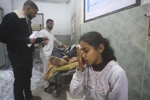 Palestinians wounded in Israeli bombardment receive treatment in a hospital t in Rafah, Gaza Strip, Monday, Feb. 5, 2024. (AP Photo/Hatem Ali)