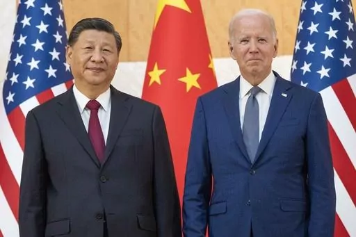 U.S. President Joe Biden, right, stands with Chinese President Xi Jinping before a meeting on the sidelines of the G20 summit on Nov. 14, 2022, in Bali, Indonesia. When Washington and Beijing do economic battle – as they have for five years now – the rest of the world suffers, too. And when they hold a top-level summit – as Biden and Xi will this week – the rest of the world pays attention. (AP Photo/Alex Brandon, File)