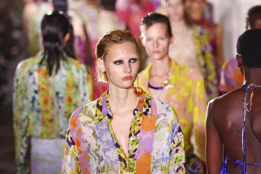 A model wears a creation for the Dries Van Noten ready-to-wear Spring/Summer 2023 fashion collection presented Wednesday, Sept. 28, 2022 in Paris. (Photo by Vianney Le Caer/Invision/AP)