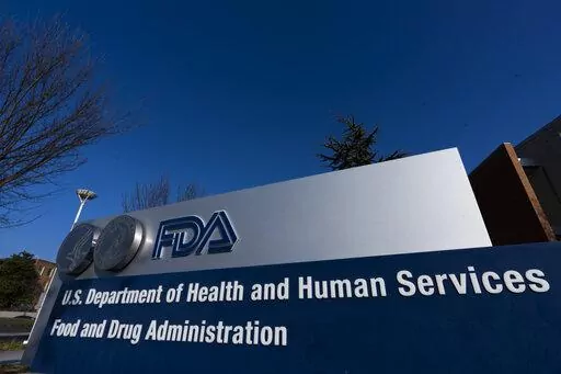 A sign in front of the Food and Drug Administration building is seen on Dec. 10, 2020, in Silver Spring, Md. Expedited drug approvals slowed in 2022, as the FDA's controversial accelerated pathway came under new scrutiny from Congress, government watchdogs and some of the agency’s own leaders. With less than a month remaining in the year, the agency’s drug center has granted 10 accelerated approvals — fewer than the tally in each of the last five years, when use of the program reached all-