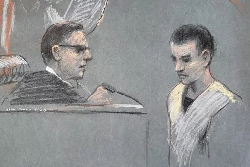 This artist depiction shows Massachusetts Air National Guardsman Jack Teixeira, right, appearing in U.S. District Court in Boston, April 14, 2023. The massive classified documents leak by an Air Force service member earlier this year was made worse by the intentional failure by multiple officials to report to take required action on his suspicious behavior, the Air Force inspector general reported Monday. Massachusetts Air National Guard member Jack Teixeira is accused of leaking highly classifi