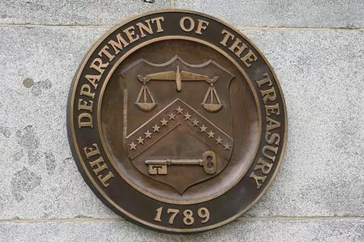 The Department of the Treasury's seal outside the Treasury Department building in Washington on May 4, 2021. The United States has slapped more sanctions on people and firms associated with Iran and with what it calls an illicit banking network used to conceal transactions. The U.S. said Thursday it placed the penalties on 39 firms linked to a shadow banking system that helped to muddy financial activity between sanctioned Iranian firms and foreign buyers, namely for petrochemicals. (AP Photo/Pa