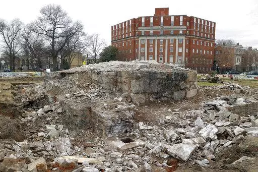 Workers recovered a copper box believed to be the 1887 time capsule that was put under Confederate Gen. Robert E. Lee statue's pedestal Monday, Dec. 27, 2021, in Richmond, Va. Here, the hole in the northeast corner of the foundation where the box was found. Crews found what appeared to be a second and long-sought-after time capsule, Virginia Gov. Ralph Northam said.  (Eva Russo/Richmond Times-Dispatch via AP)