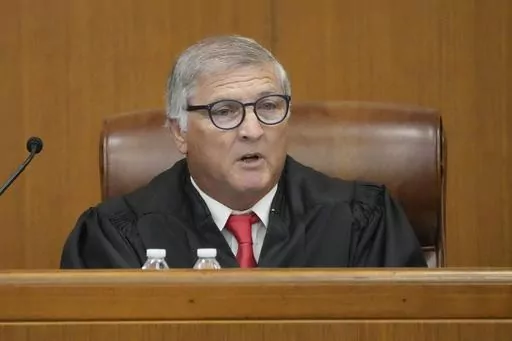 Hinds County Chancery Judge Dewayne Thomas speaks to the parties involved at a hearing, Wednesday, May 10, 2023, in Hinds County Chancery Court in Jackson, Miss., where he heard arguments about a Mississippi law that would create a court system with judges who would be appointed rather than elected. (AP Photo/Rogelio V. Solis)