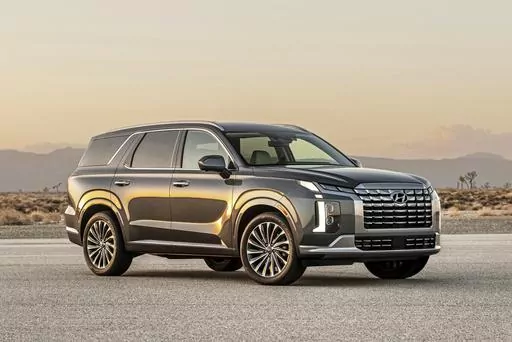 This photo provided by Hyundai shows the 2023 Hyundai Palisade a midsize three-row SUV. Both the Palisade and its corporate cousin, the Kia Telluride, are top picks in this class. (Courtesy of Hyundai Motor America via AP)