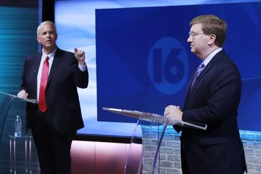 Brandon Presley, the Democratic nominee for governor, left, debates with Republican Mississippi Gov. Tate Reeves during a televised gubernatorial debate Wednesday, Nov. 1, 2023, in Jackson, Miss. (Brett Kenyon/WAPT via the AP)