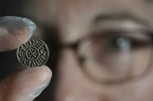 An early medieval silver penny of Guthrum of East Anglia, the first silver coin minted by a Viking ruler in Britain, is displayed at the British Museum's annual treasure launch in London, Tuesday, Feb. 11, 2025. (AP Photo/Kirsty Wigglesworth)