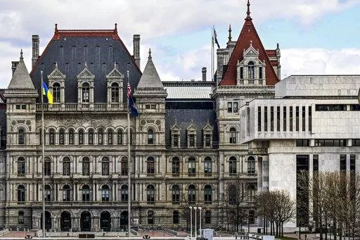 A partial views of the New York state Capitol building, left, is shown next to the state Appellate court building in foreground, right, Monday, April 4, 2022, in Albany, N.Y. A panel of five mid-level New York appellate judges have ruled on Thursday, April 21, 2022 that state Democrats engaged in gerrymandering when drawing new congressional district boundaries for the next decade. (AP Photo/Hans Pennink, File)