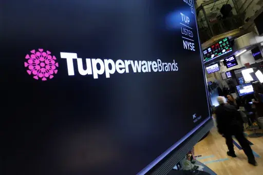 The logo for Tupperware Brands appears above a trading post on the floor of the New York Stock Exchange on Oct. 30, 2019. (AP Photo/Richard Drew)