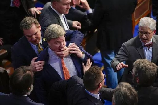 Rep. Richard Hudson, R-N.C., left, pulls Rep. Mike Rogers, R-Ala., back as they talk with Rep. Matt Gaetz, R-Fla., and others during the 14th round of voting for speaker as the House meets for the fourth day to try and elect a speaker and convene the 118th Congress in Washington, Friday, Jan. 6, 2023. At right is Rep. Patrick McHenry, R-N.C. (AP Photo/Andrew Harnik)