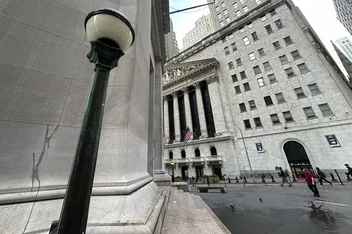 The New York Stock Exchange, at rear, is shown on Sept. 24, 2024, in New York. (AP Photo/Peter Morgan, File)