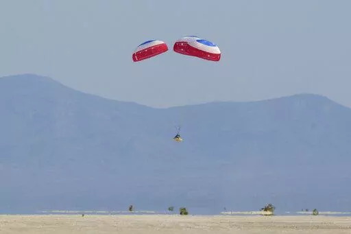 Boeing's CST-100 Starliner spacecraft lands at White Sands Missile Range's Space Harbor, Wednesday, May 25, 2022, in New Mexico. (Bill Ingalls/NASA via AP)