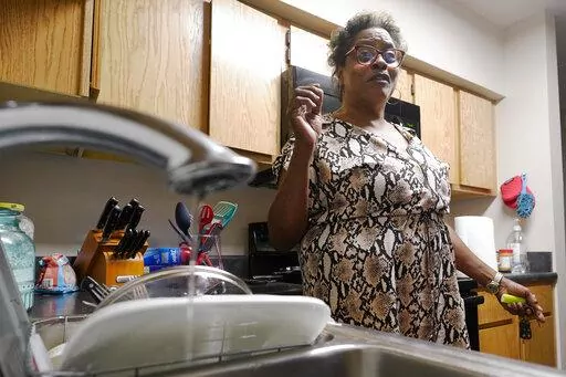 A trickle of water comes out of the faucet at Mary Gaines' Golden Keys Senior Living apartment in Jackson, Miss., Sept. 1, 2022. The federal government will put $600 million toward repairing the troubled water system in Mississippi's capital city...a project that the mayor has said could cost billions of dollars. Funding for Jackson, Miss., water is included in a $1.7 trillion federal spending bill that passed the Senate on Thursday, Dec. 22, and the House on Friday, Dec. 23. President Joe Biden
