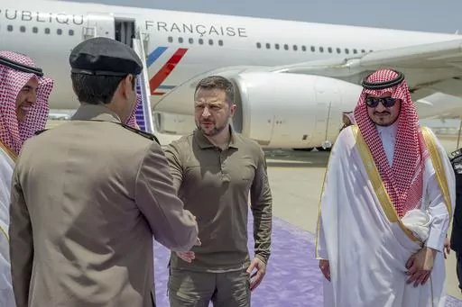 In this photo provided by Saudi Press Agency, SPA, Ukraine's President Volodymyr Zelenskyy, second right, is greeted by Prince Badr Bin Sultan, deputy governor of Mecca, right, upon his arrival at Jeddah airport, Saudi Arabia, Friday, May 19, 2023. Japan’s government officially announced Saturday that Zelenskyy is visiting Japan to join Group of Seven leaders in a session on Ukraine on Sunday. (Saudi Press Agency via AP, File)