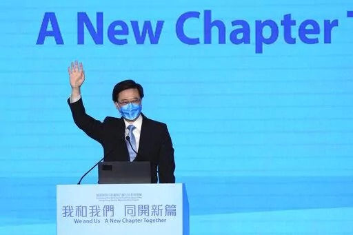 John Lee, former No. 2 official in Hong Kong, and the only candidate for the city's top job, attends his 2022 chief executive electoral campaign rally in Hong Kong, Friday, May 6, 2022. China is moving to install Lee as the new leader of Hong Kong in the culmination of a sweeping political transformation that has gutted the Asian financial center's democratic institutions and placed it ever more firmly under Beijing's control. (AP Photo/Kin Cheung)