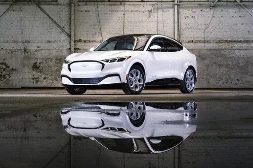 This photo provided by Ford shows the 2022 Ford Mustang Mach-E, a compact electric SUV with an EPA-estimated range of 224-314 miles depending on the configuration. (Courtesy of the Ford Motor Co. via AP)